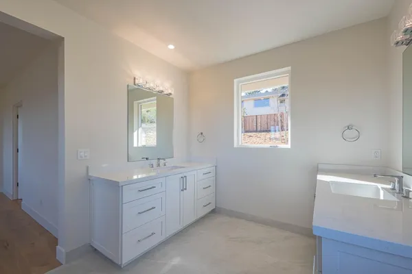 a bathroom with a glass shower door