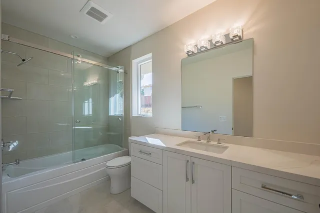 a bathroom with a shower and a toilet