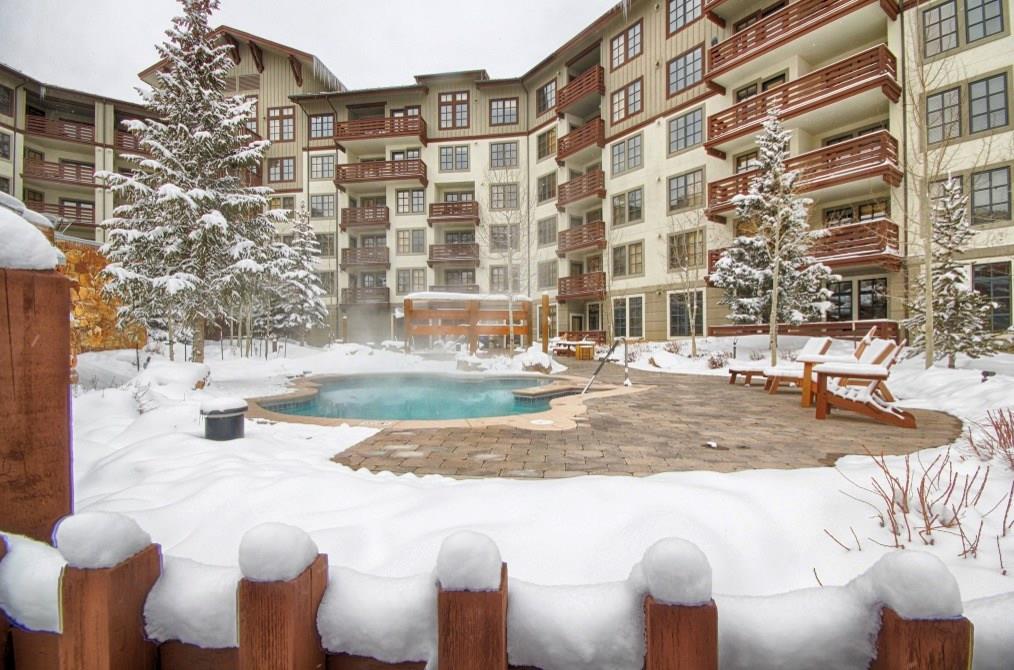 a view of a building with a yard