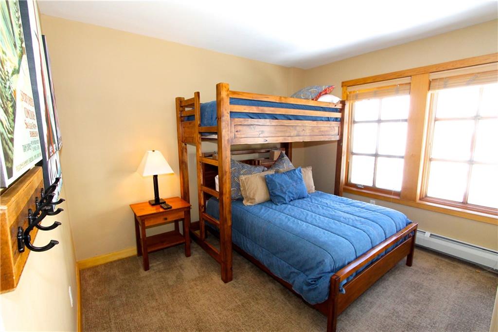 910 Copper Road, Unit 303 Copper Mountain, CO 80443 - Photo 16 of 26 a bedroom with a bed and window