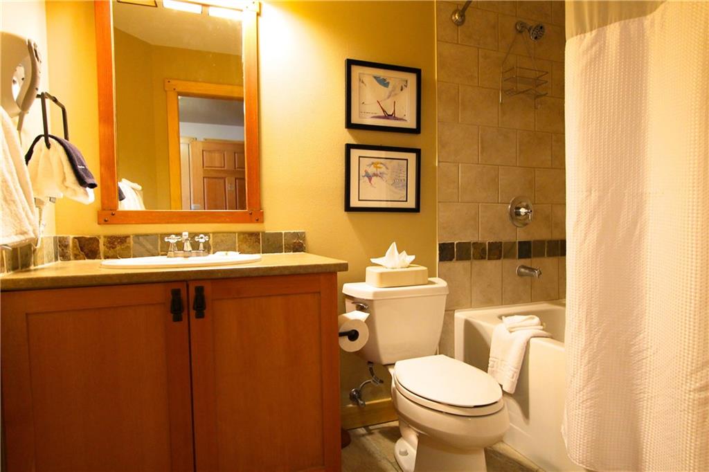 910 Copper Road, Unit 303 Copper Mountain, CO 80443 - Photo 17 of 26 a bathroom with a sink and a toilet