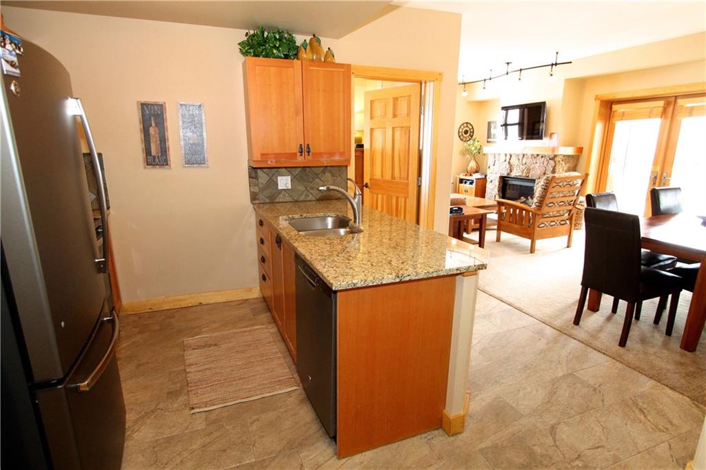 910 Copper Road, Unit 303 Copper Mountain, CO 80443 - Photo 3 of 26 a living room with stainless steel appliances granite countertop furniture a refrigerator and a view of living room