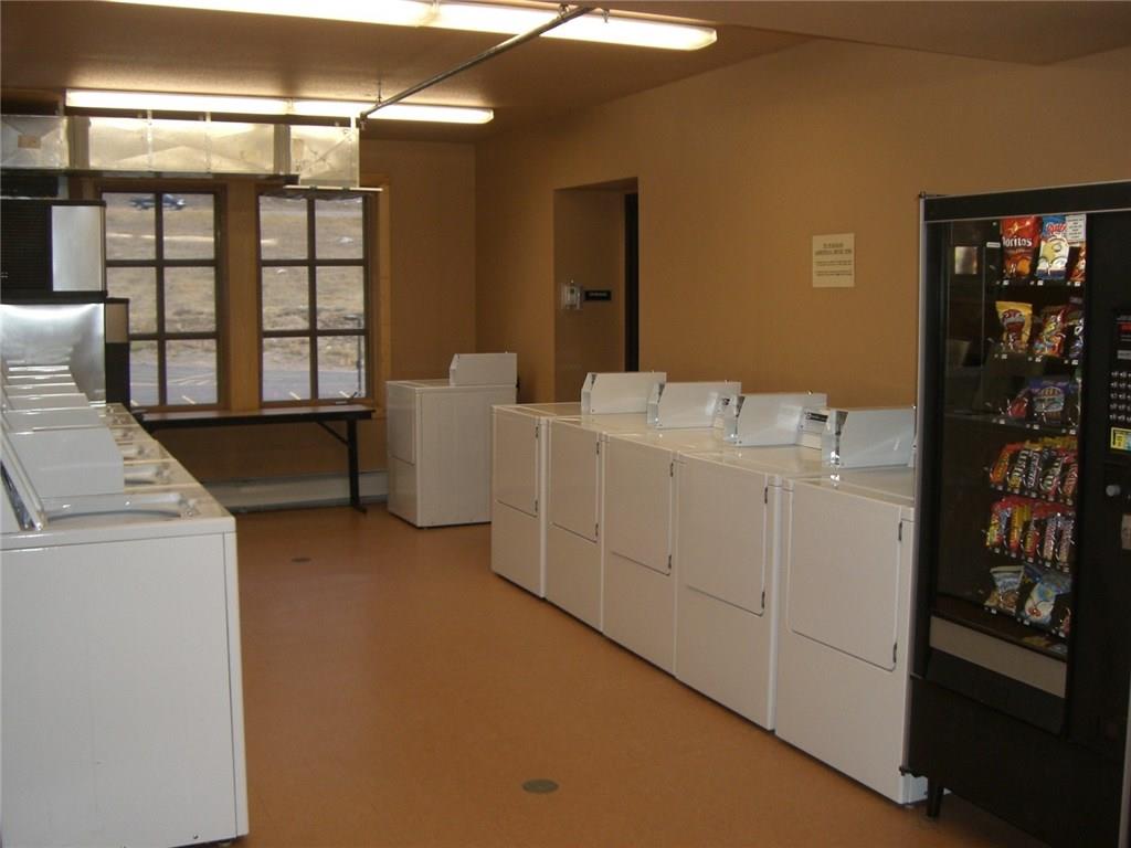 910 Copper Road, Unit 303 Copper Mountain, CO 80443 - Photo 24 of 26 a utility room with dryer and washer