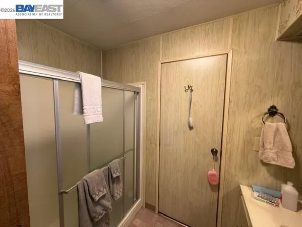 a bathroom with a shower and a sink