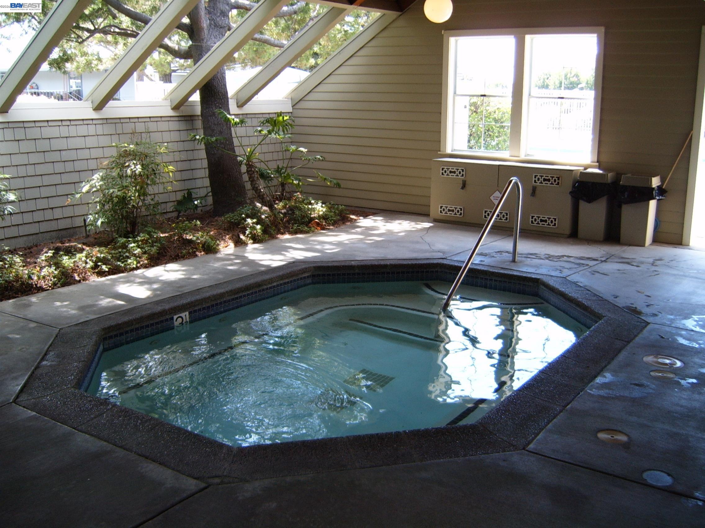29266 Nantucket Way Hayward, CA 94544 - Photo 20 of 24 a view of a swimming pool with a yard