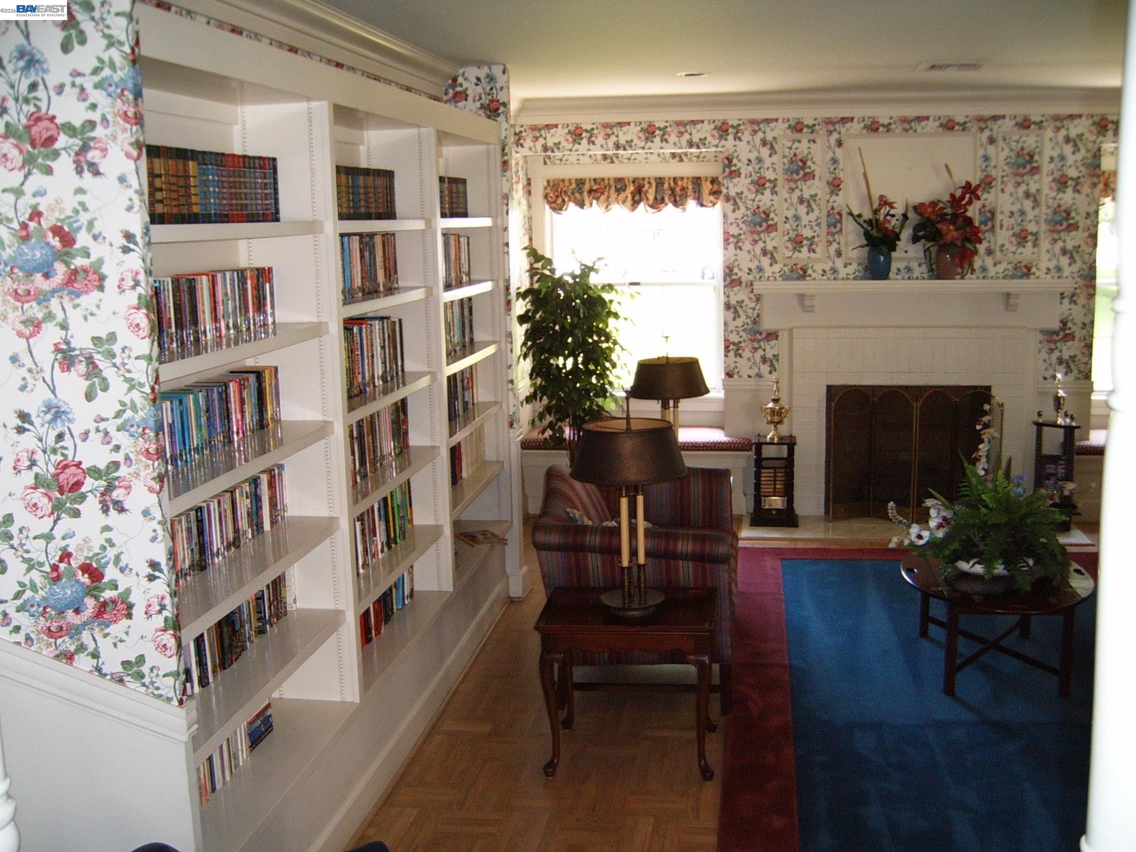 29266 Nantucket Way Hayward, CA 94544 - Photo 23 of 24 a living room with furniture a fireplace and a potted plant