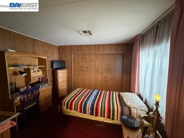 a bedroom with a bed and closet