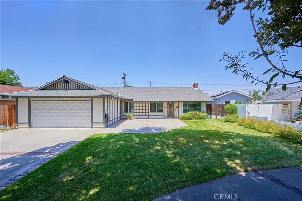8949 Hope Avenue Riverside, CA 92503 - Photo 1 of 1 a front view of a house with a yard and garage