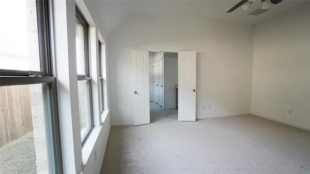 a bathroom with a shower sink and mirror