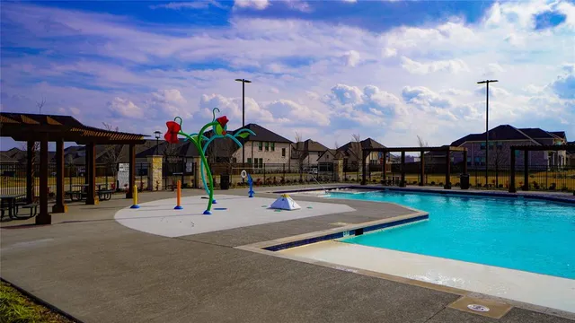 a view of a swimming pool with a deck