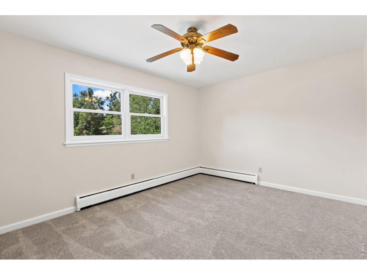 2121 18th Street Road Greeley, CO 80631 - Photo 32 of 40 Upstairs 3rd bedroom has all new windows, carpet and paint throughout.