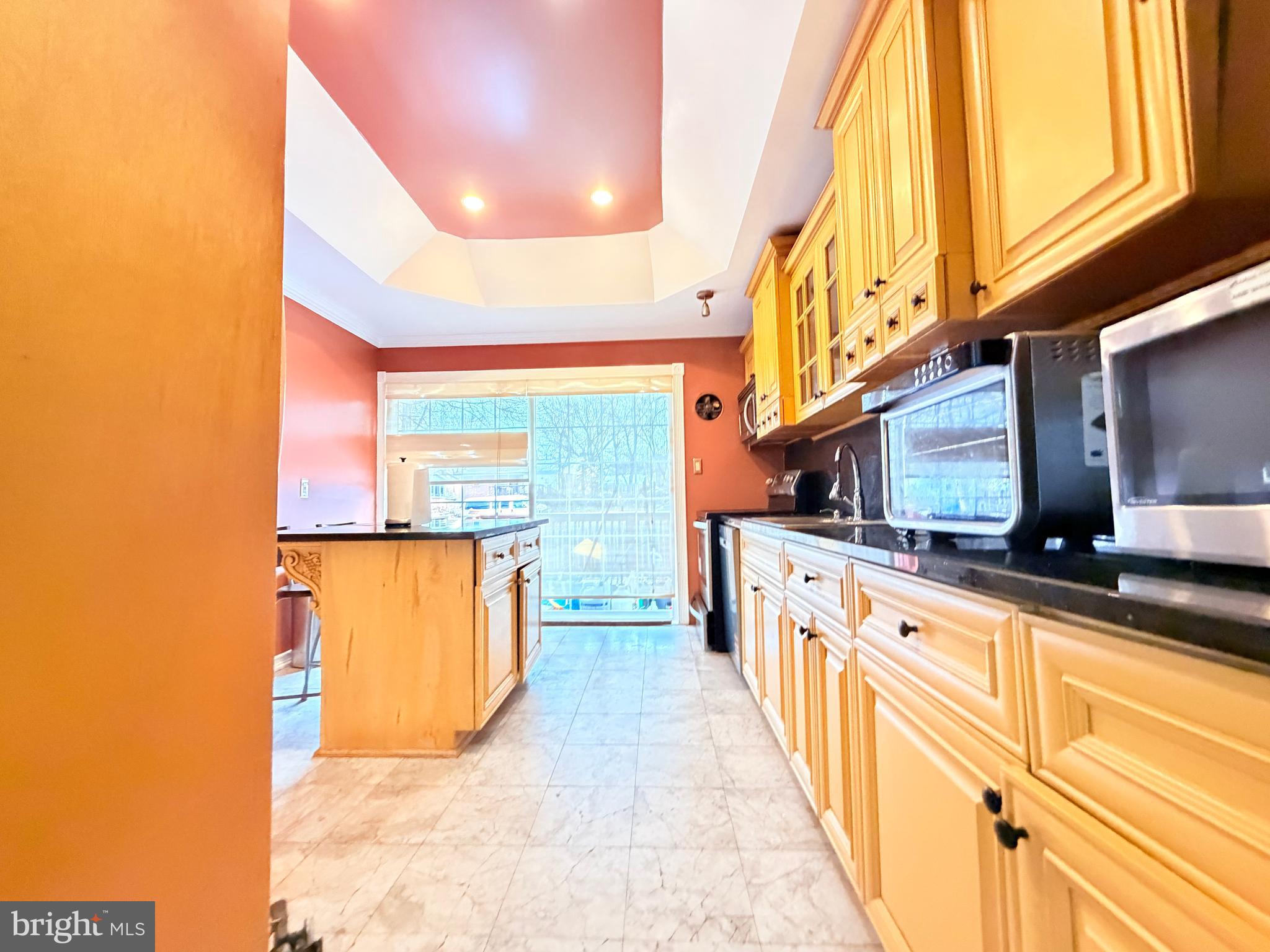 2003 Prichard Road Silver Spring, MD 20902 - Photo 11 of 45 a kitchen with stainless steel appliances a sink and cabinets
