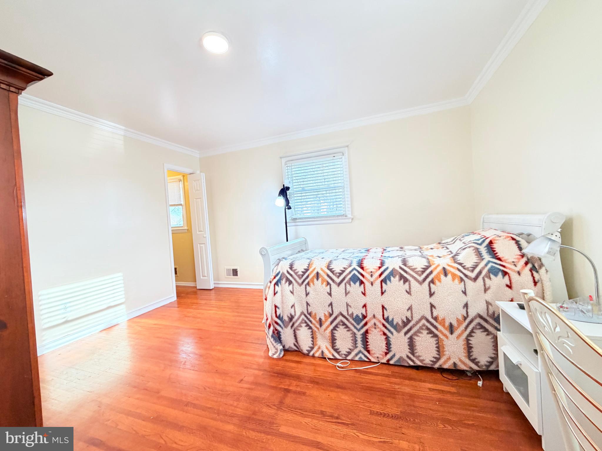 2003 Prichard Road Silver Spring, MD 20902 - Photo 15 of 45 a bedroom with a bed and a window