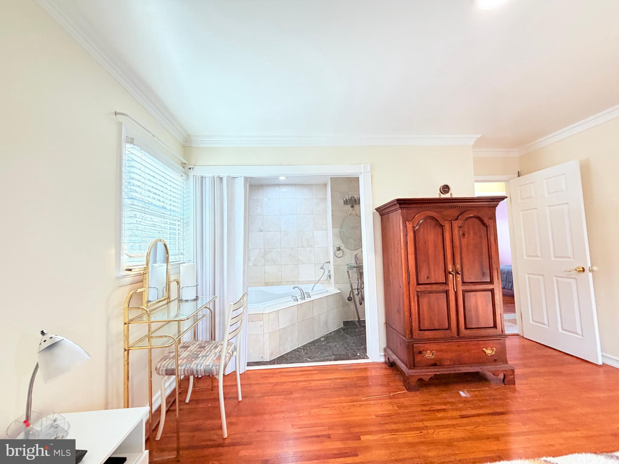 2003 Prichard Road Silver Spring, MD 20902 - Photo 16 of 45 a view of a livingroom with wooden floor and furniture