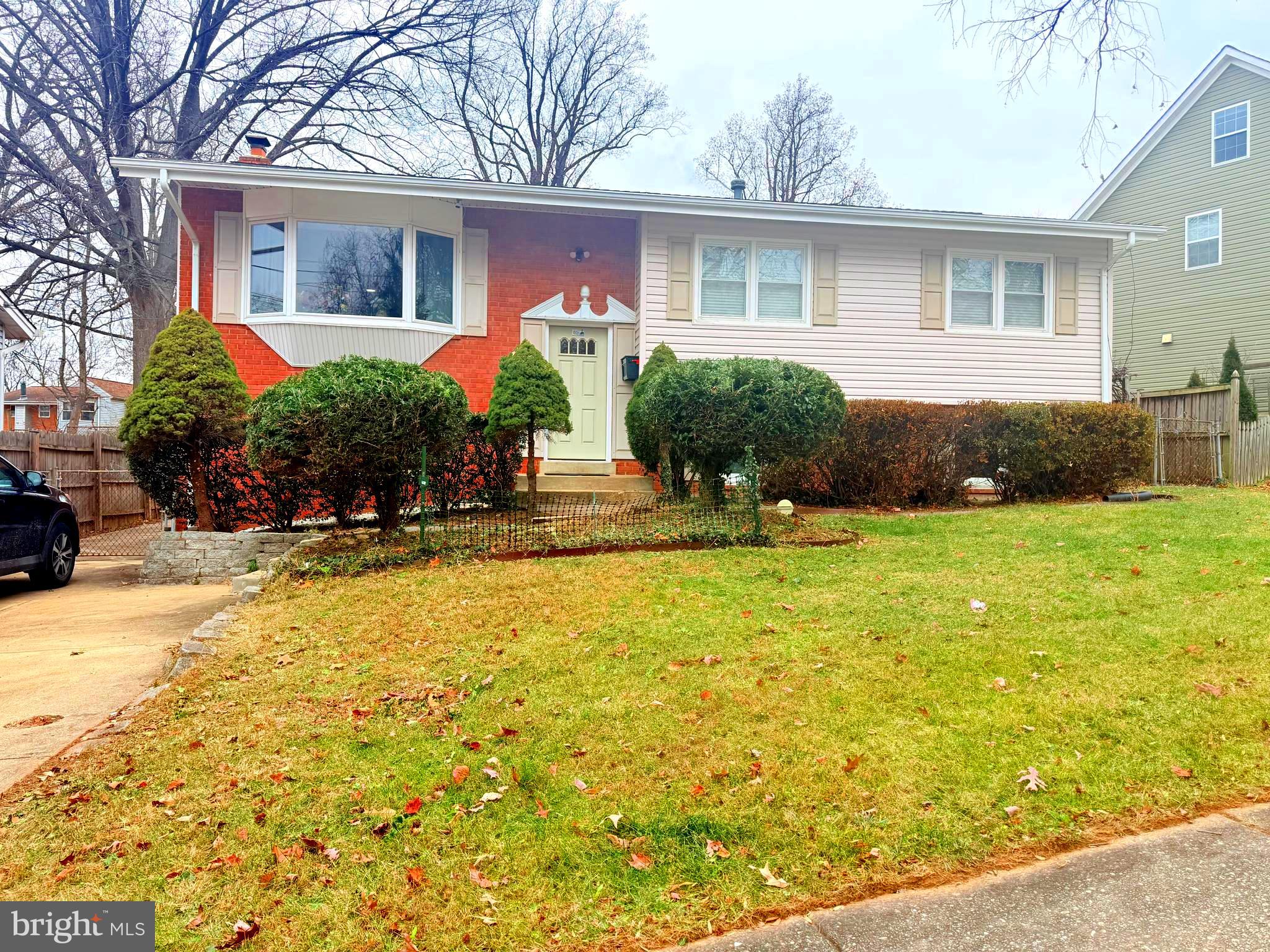 2003 Prichard Road Silver Spring, MD 20902 - Photo 2 of 45 a front view of house with yard and trees around