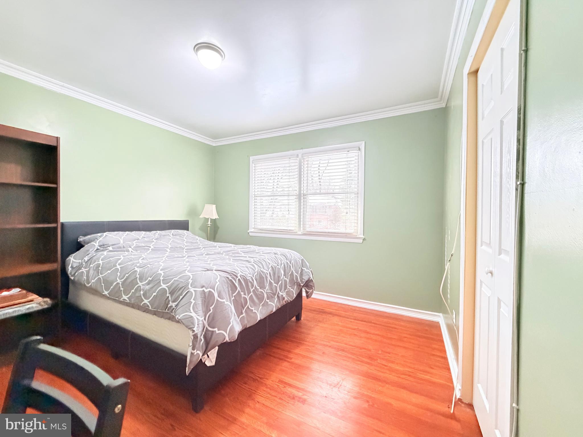 2003 Prichard Road Silver Spring, MD 20902 - Photo 21 of 45 a bedroom with a bed and wooden floor