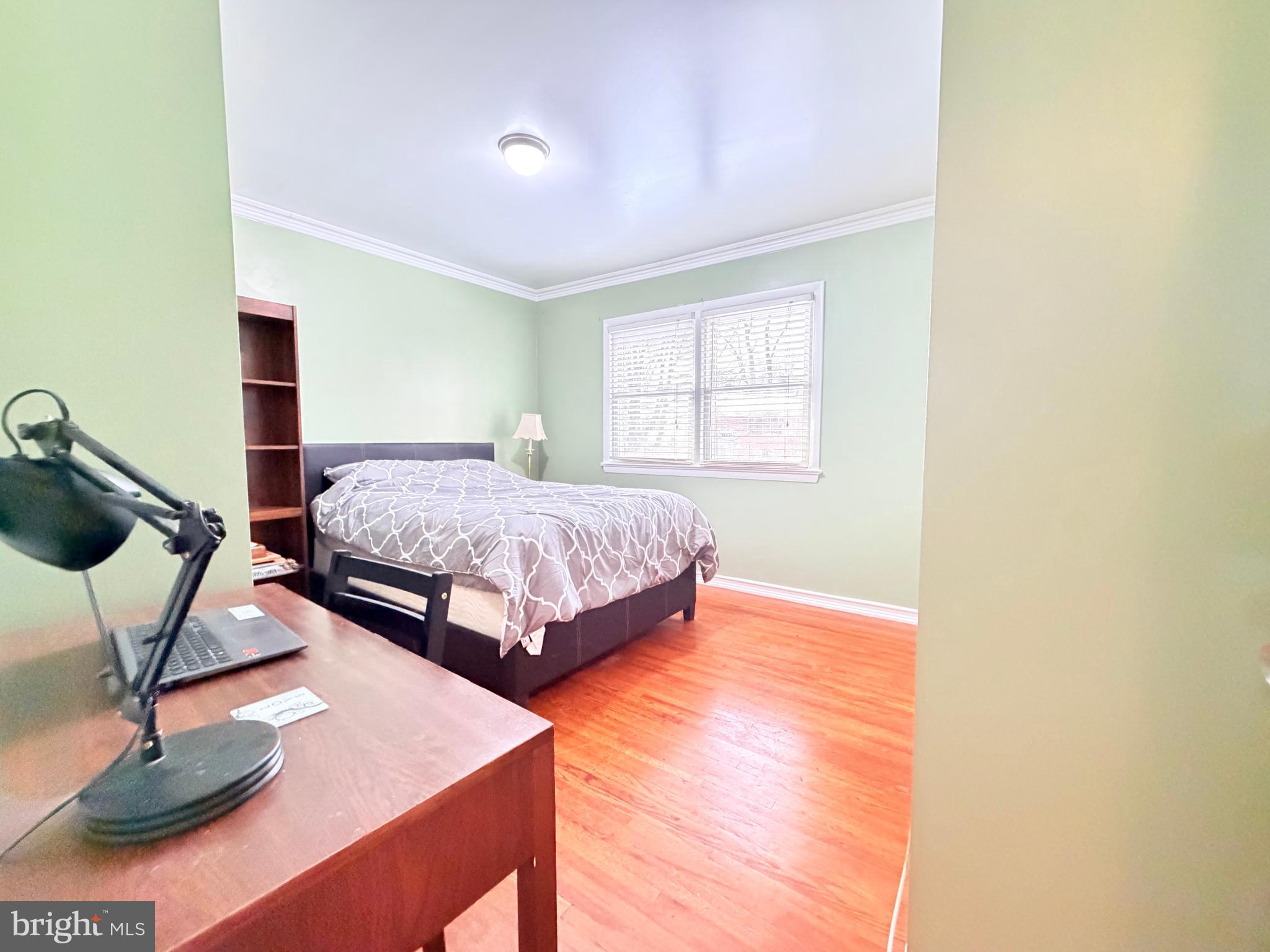 2003 Prichard Road Silver Spring, MD 20902 - Photo 22 of 45 a bedroom with a bed and window