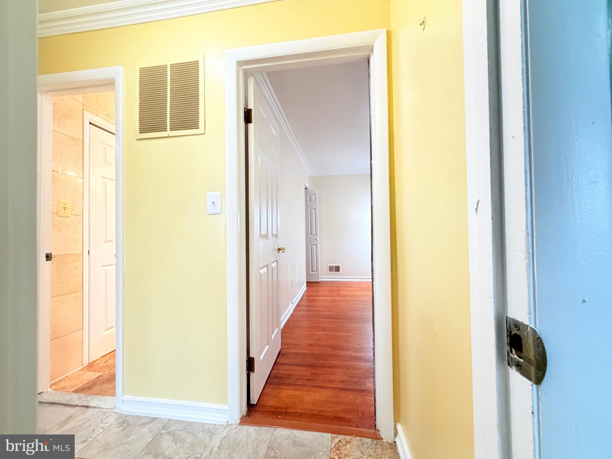 2003 Prichard Road Silver Spring, MD 20902 - Photo 24 of 45 a view of a hallway with wooden floor and a bathroom