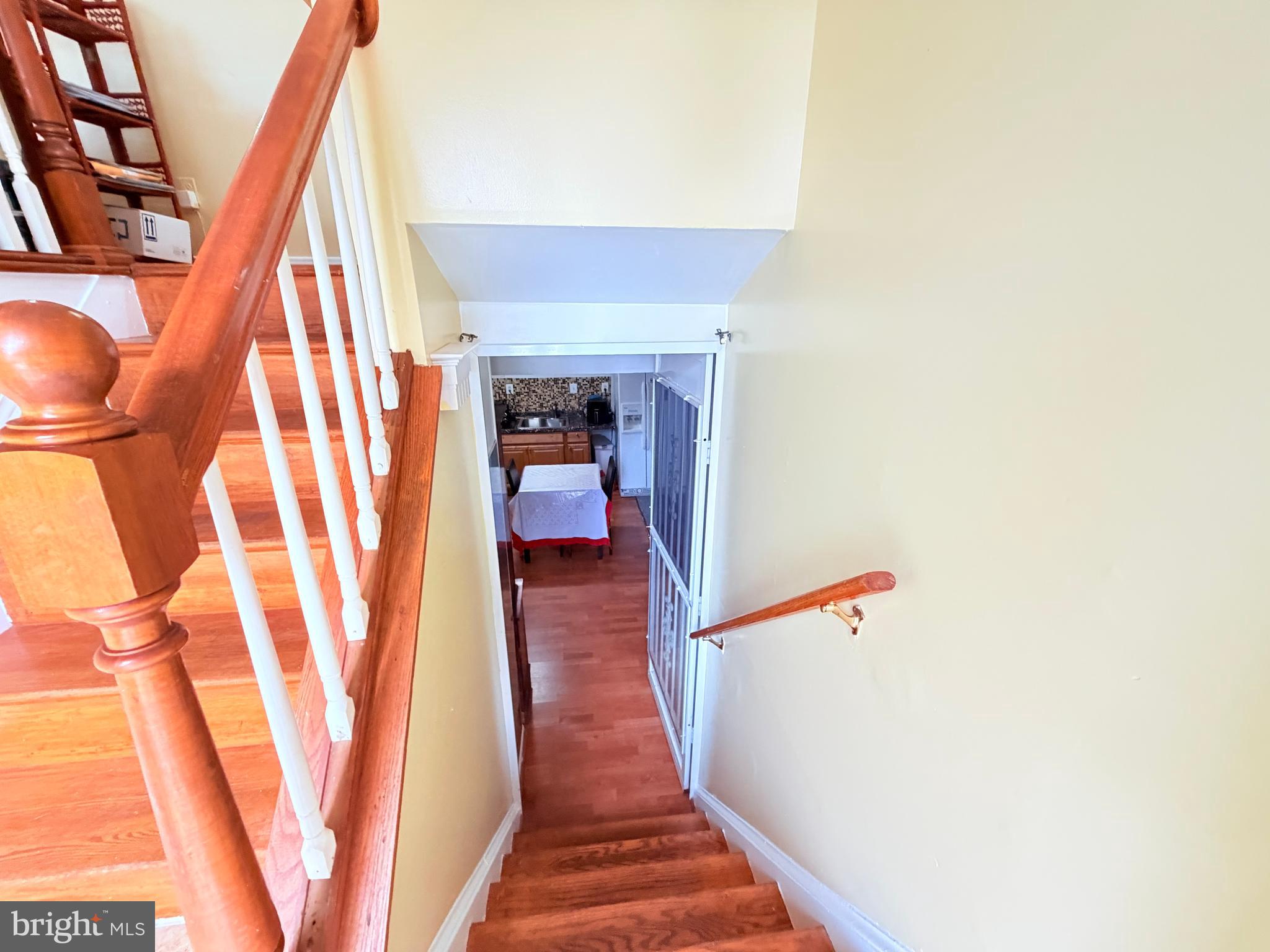 2003 Prichard Road Silver Spring, MD 20902 - Photo 29 of 45 a view of a hallway with wooden floor and staircase