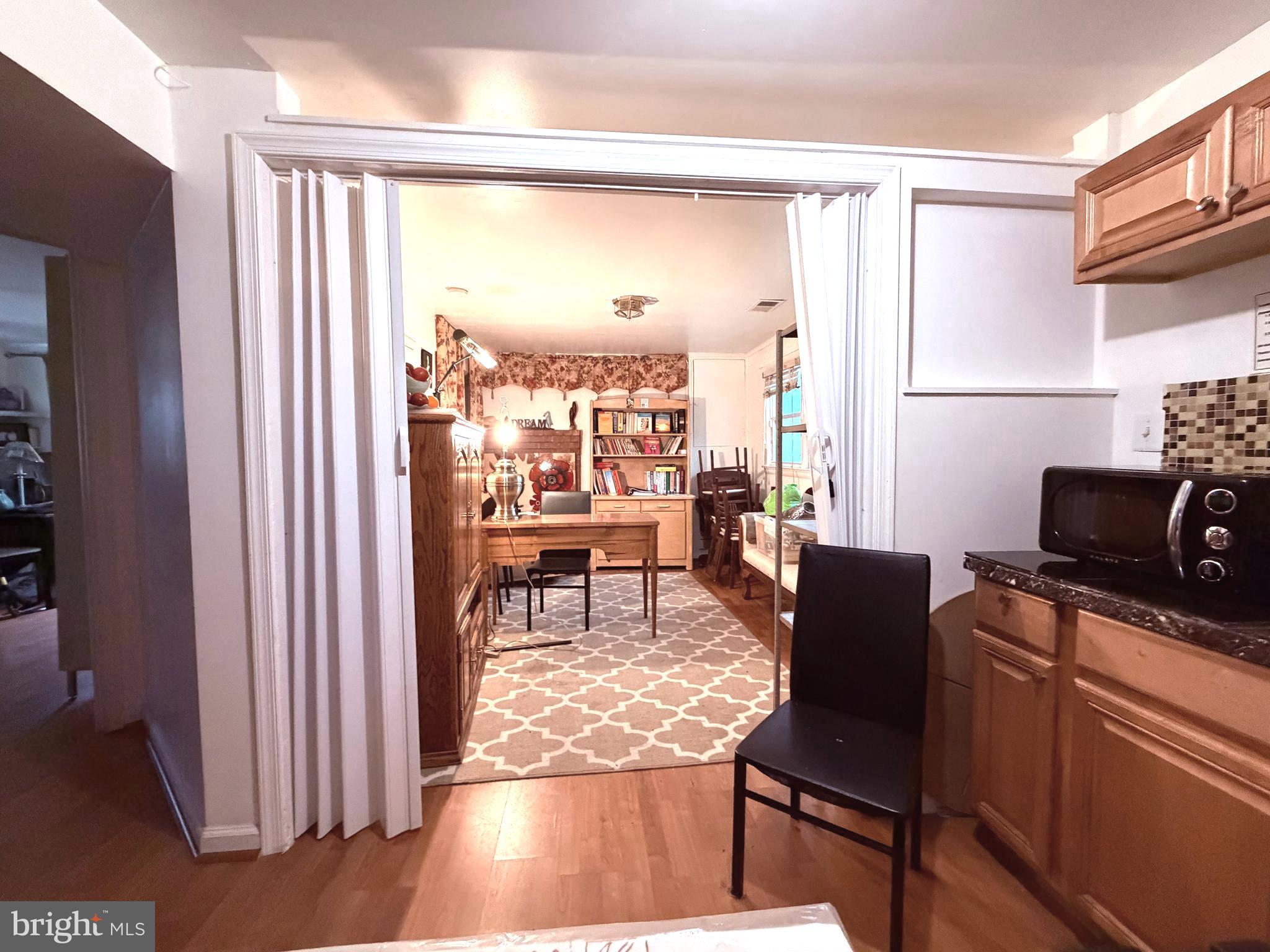 2003 Prichard Road Silver Spring, MD 20902 - Photo 32 of 45 a living room with furniture and a window