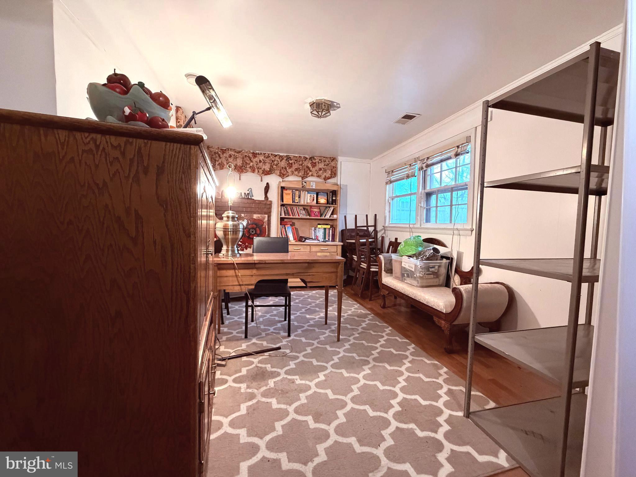 2003 Prichard Road Silver Spring, MD 20902 - Photo 33 of 45 a living room with furniture and a window