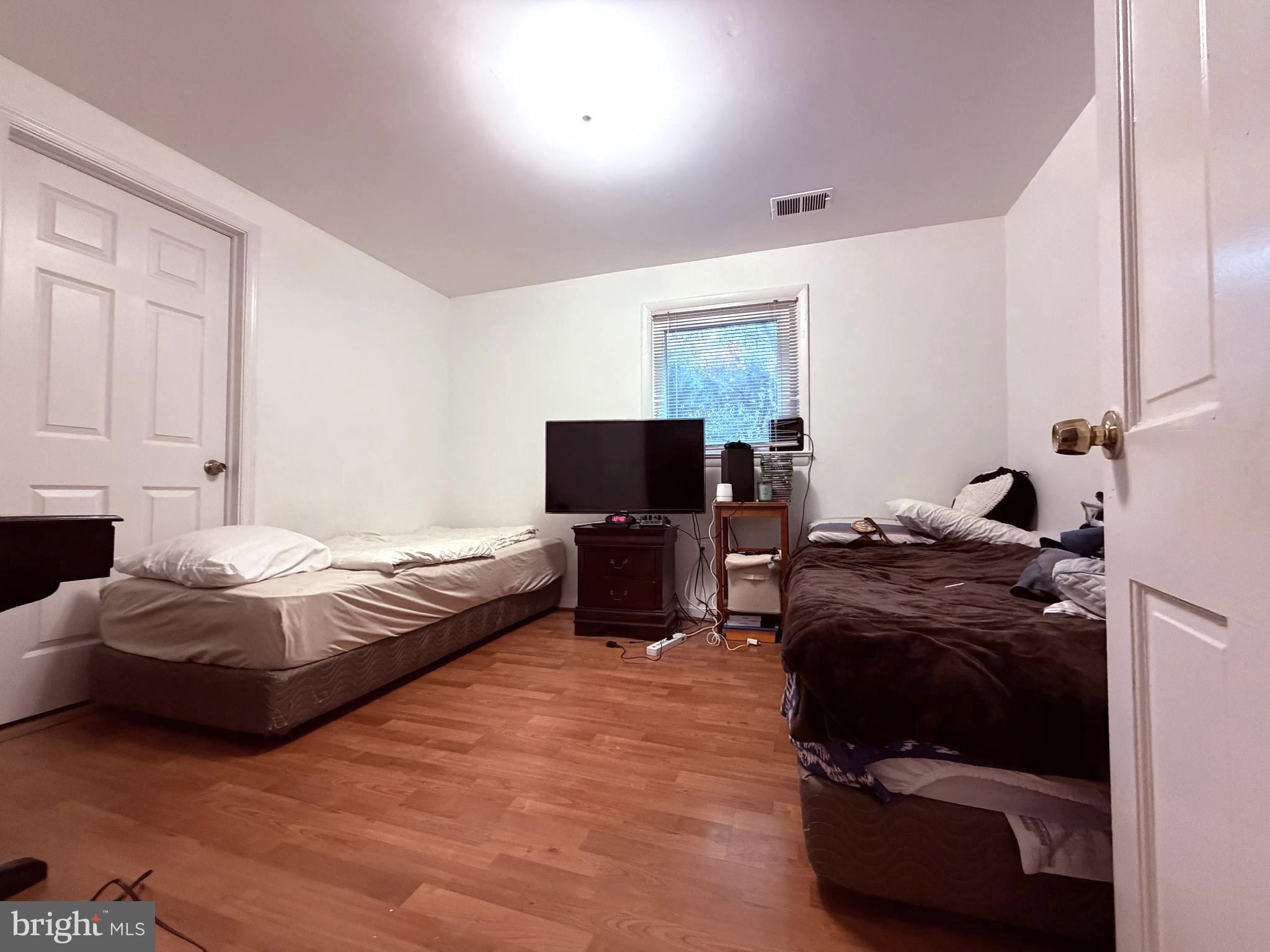 2003 Prichard Road Silver Spring, MD 20902 - Photo 35 of 45 a bedroom with bed and a couch