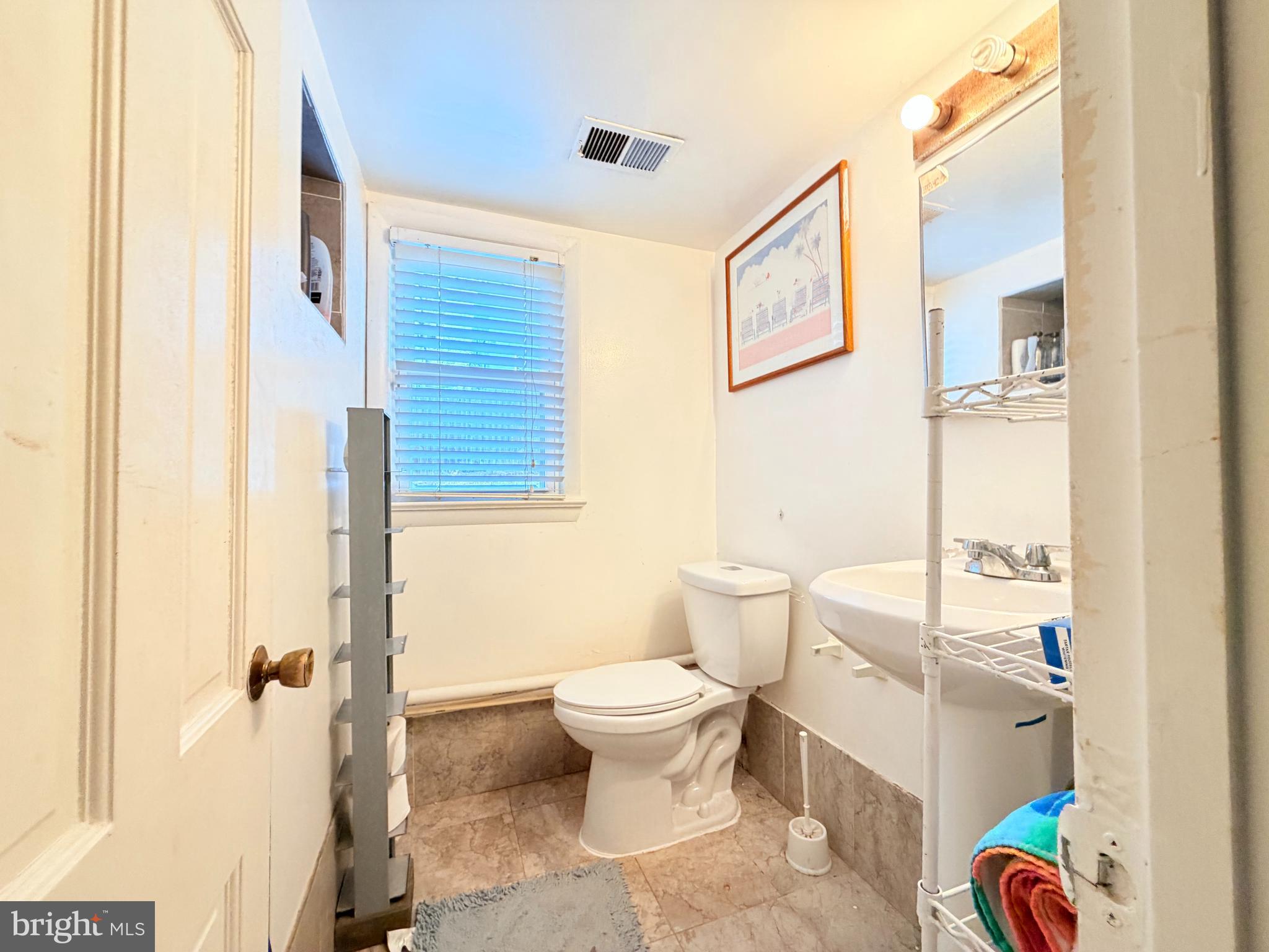 2003 Prichard Road Silver Spring, MD 20902 - Photo 37 of 45 a bathroom with a sink toilet and shower