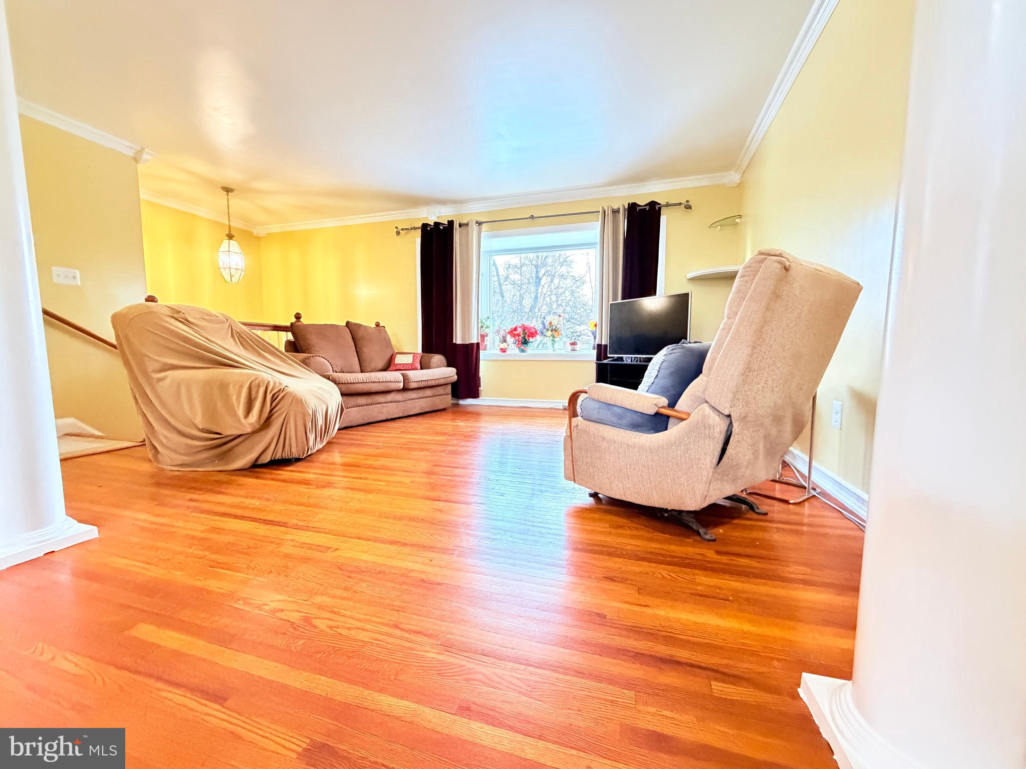 2003 Prichard Road Silver Spring, MD 20902 - Photo 4 of 45 a living room with furniture and a flat screen tv