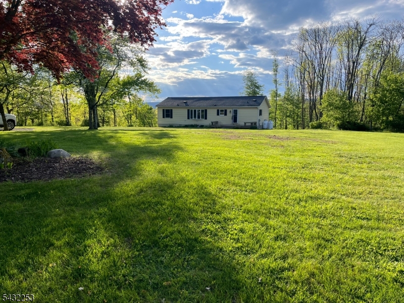31 Countryside Road Columbia, NJ 07832 - Photo 1 of 31 a front view of house with yard and green space