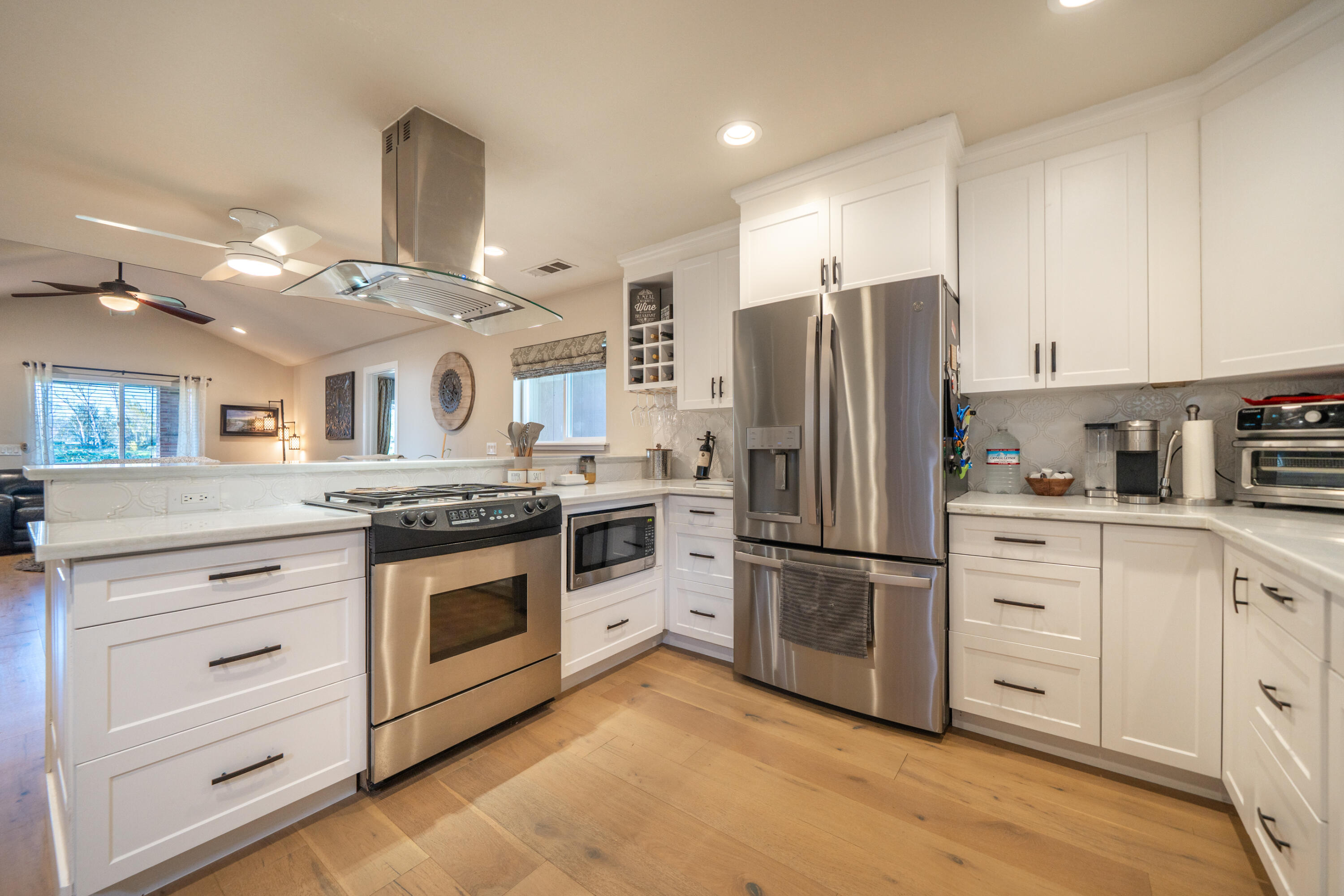 2385 Alexander Avenue Anderson, CA 96007 - Photo 13 of 72 a kitchen with stainless steel appliances granite countertop a refrigerator a stove and a sink