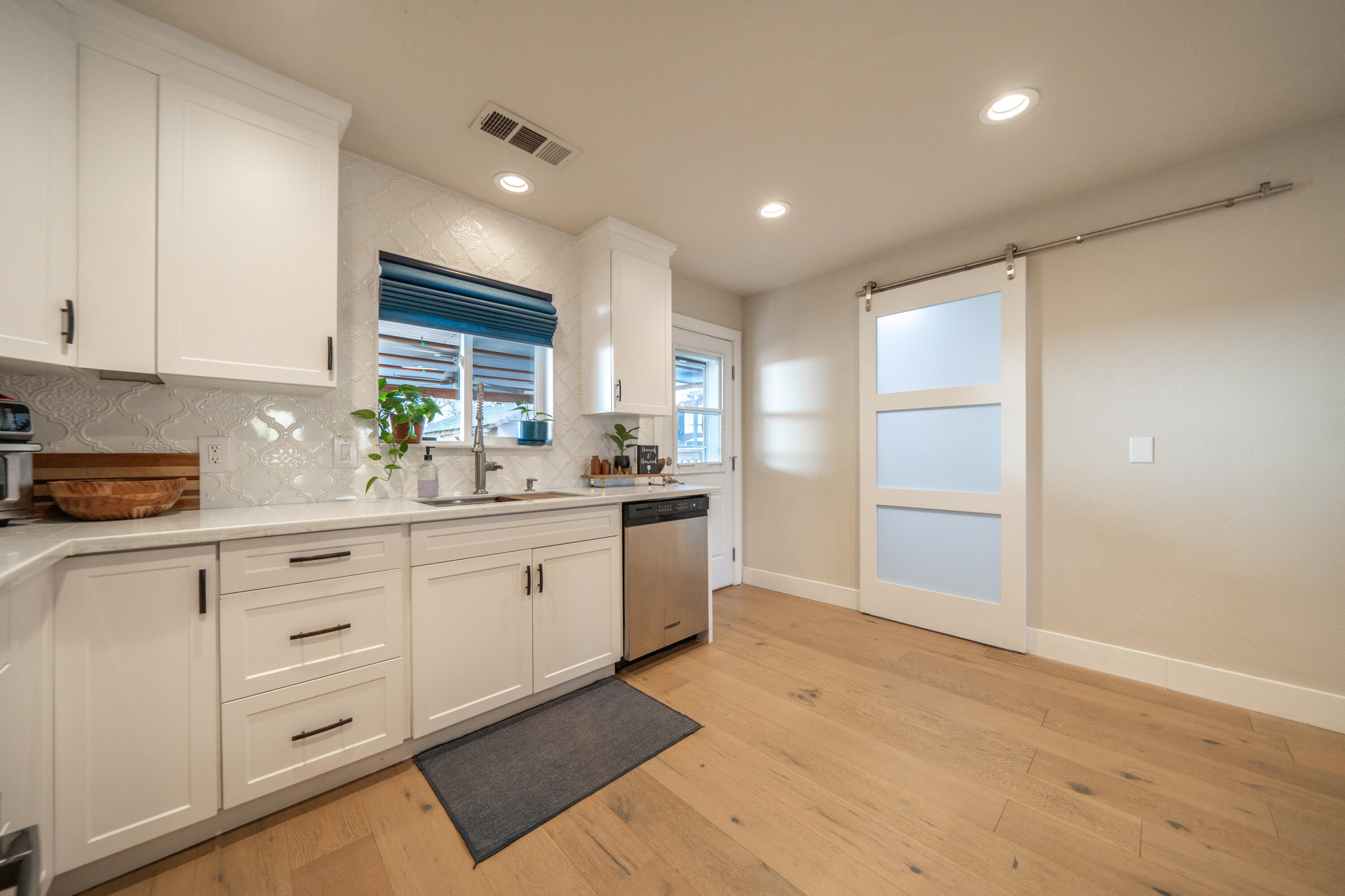 2385 Alexander Avenue Anderson, CA 96007 - Photo 14 of 72 a kitchen with white cabinets and white appliances