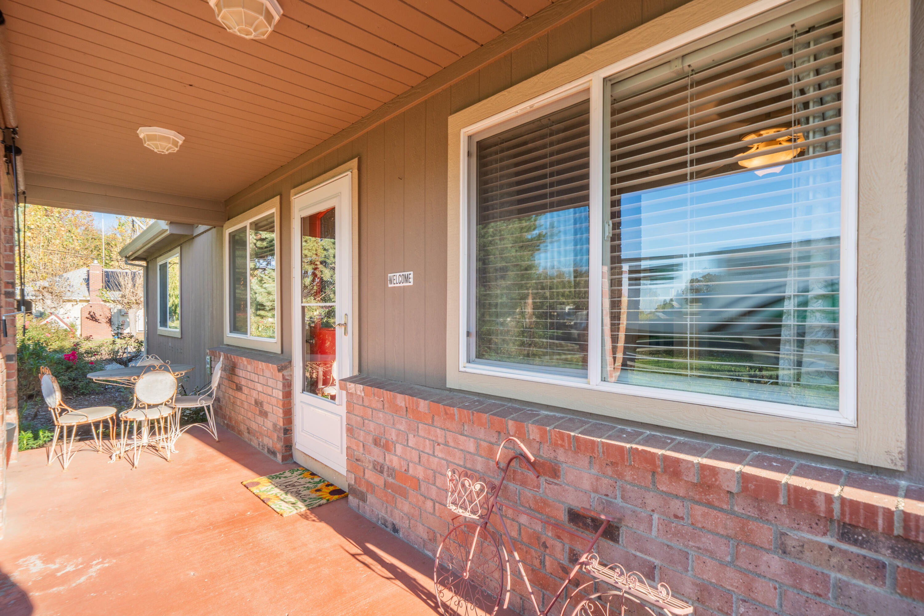 2385 Alexander Avenue Anderson, CA 96007 - Photo 4 of 72 a view of a porch with chairs and backyard