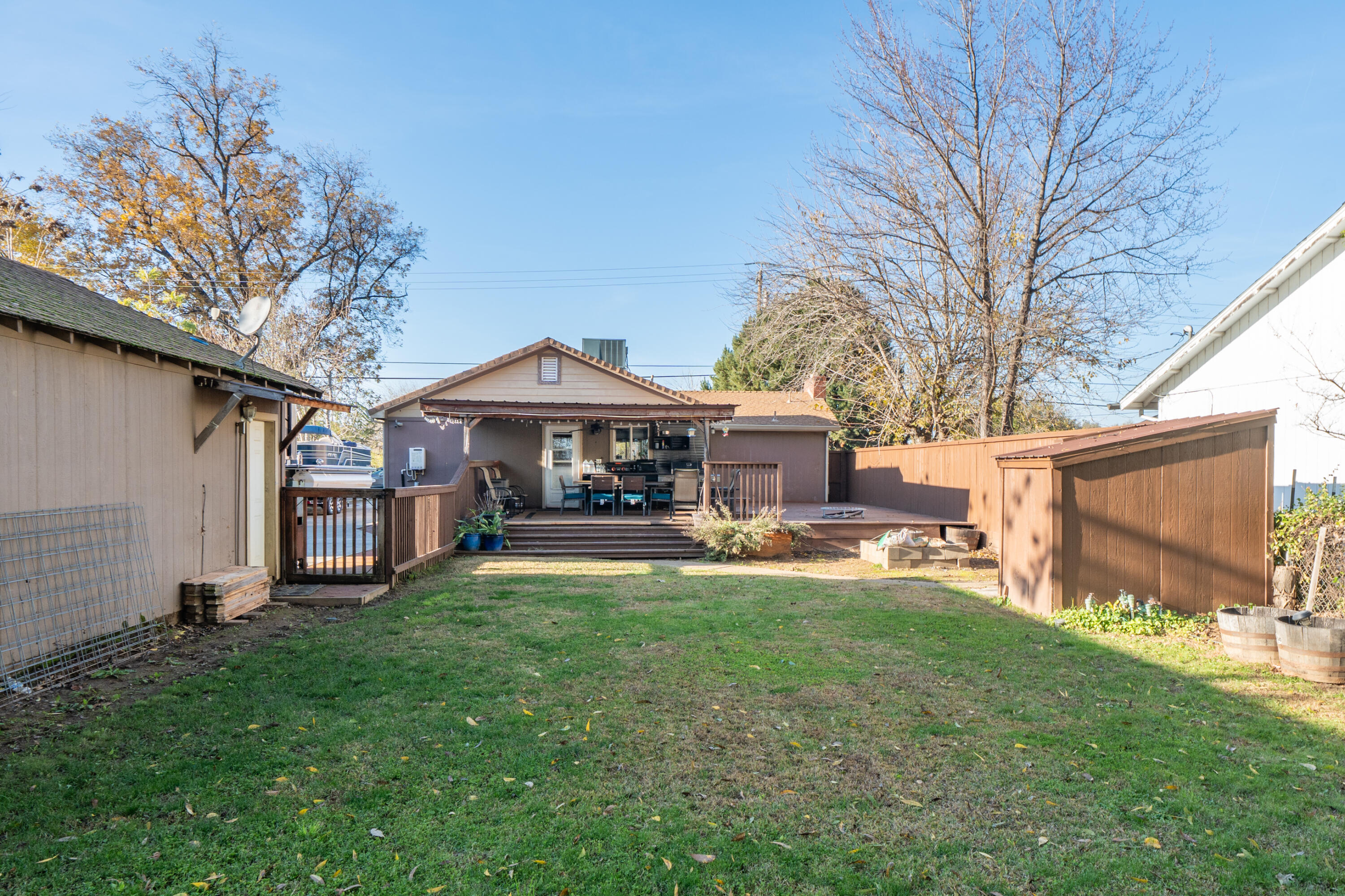 2385 Alexander Avenue Anderson, CA 96007 - Photo 50 of 72 a view of a house with a yard deck and a small yard