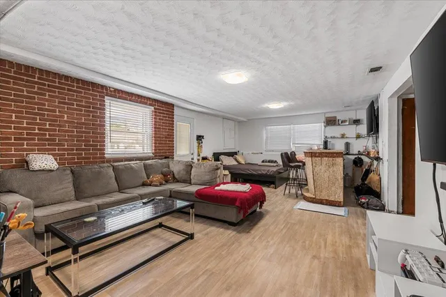 a living room with furniture window and a table