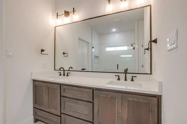a bathroom with a glass shower door