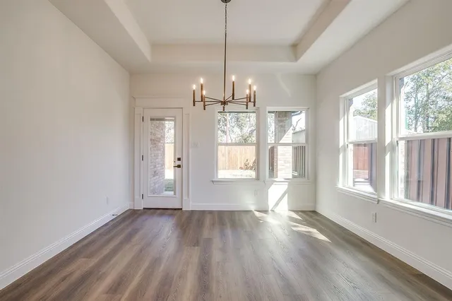 a view of a kitchen with a sink and microwave