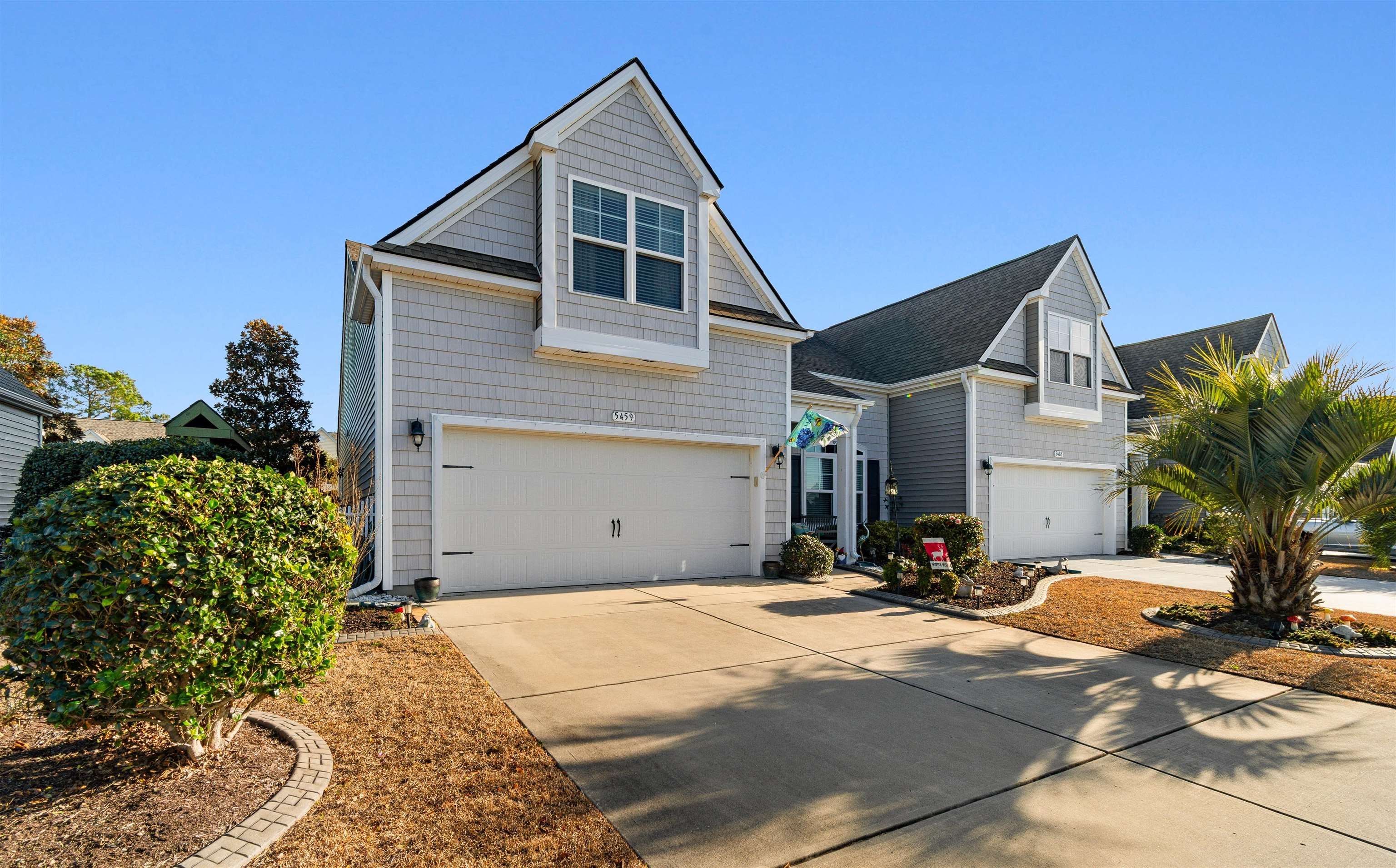 5459 Elba Way, Unit 1501 Myrtle Beach, SC 29579 - Photo 2 of 31 View of front facade with concrete driveway and a garage