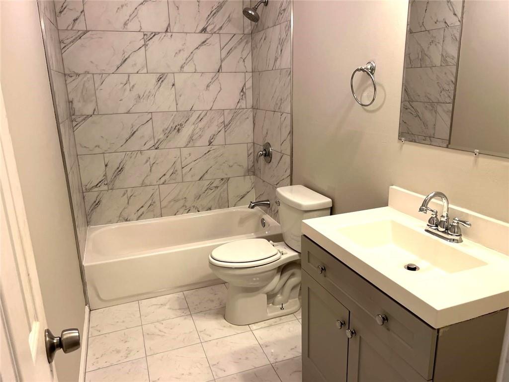 566 Rockwell Street Southwest Atlanta, GA 30310 - Photo 15 of 23 a bathroom with a sink toilet and shower