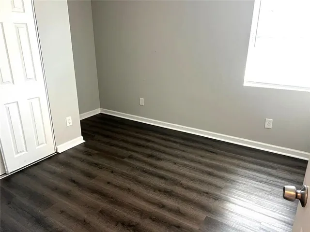 a view of balcony with wooden floor and fence