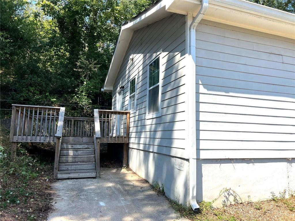 566 Rockwell Street Southwest Atlanta, GA 30310 - Photo 18 of 23 a view of balcony with wooden floor and fence