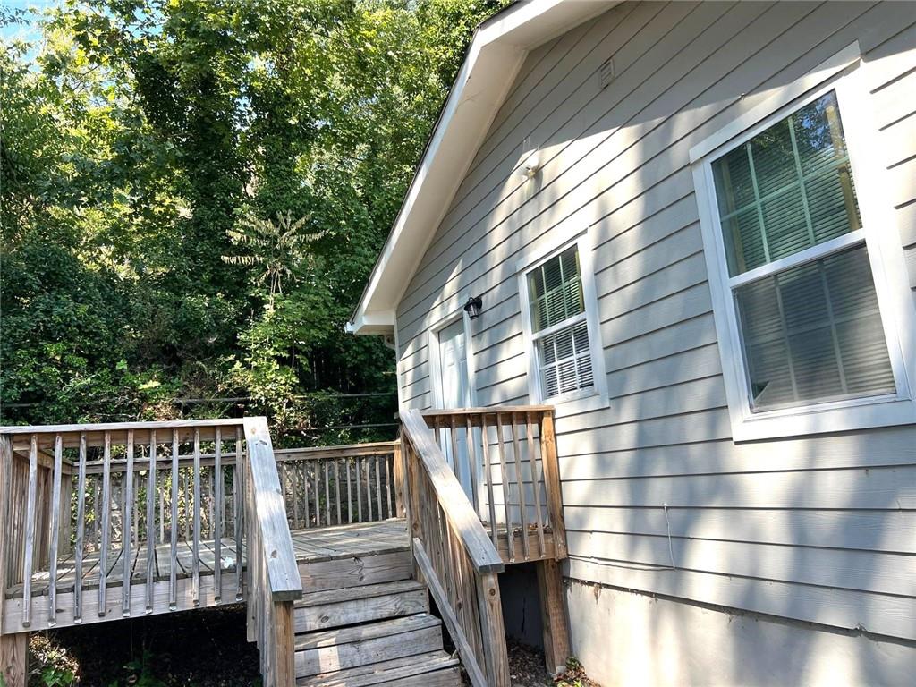 566 Rockwell Street Southwest Atlanta, GA 30310 - Photo 22 of 23 a view of balcony with wooden floor and fence