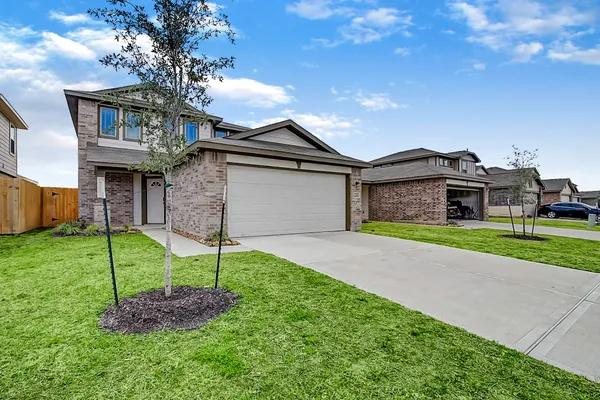 a house view with a garden space
