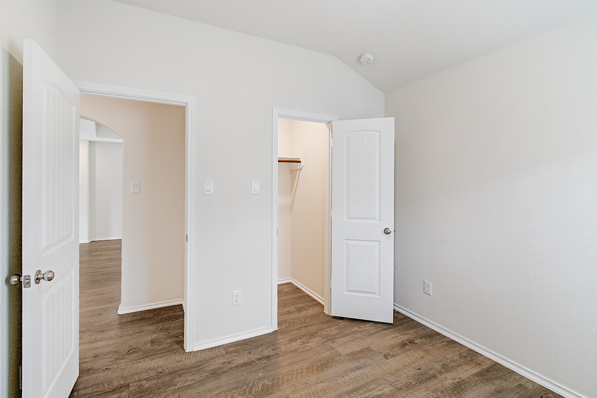 14468 Conifer Drive Conroe, TX 77302 - Photo 14 of 21 an empty room with wooden floor & windows