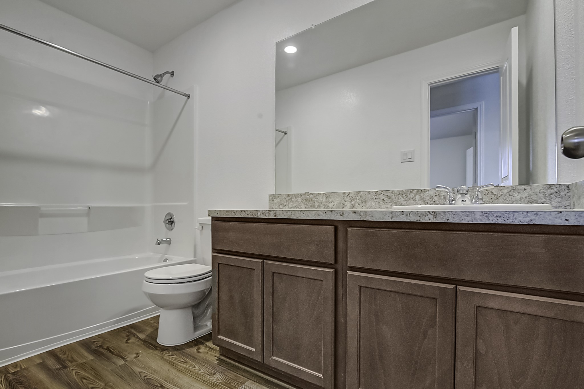 14468 Conifer Drive Conroe, TX 77302 - Photo 17 of 21 a bathroom with a granite countertop sink toilet and shower
