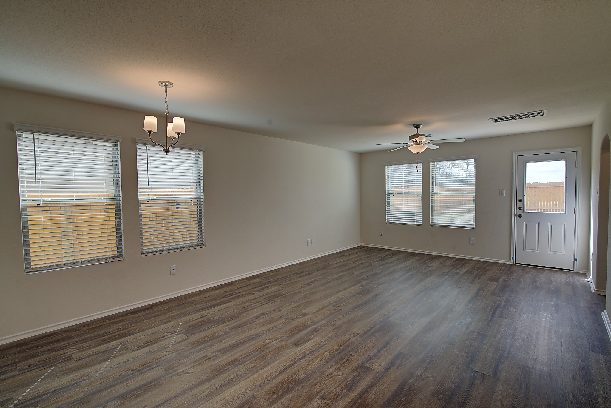 14468 Conifer Drive Conroe, TX 77302 - Photo 4 of 21 a view of an empty room with wooden floor and a window