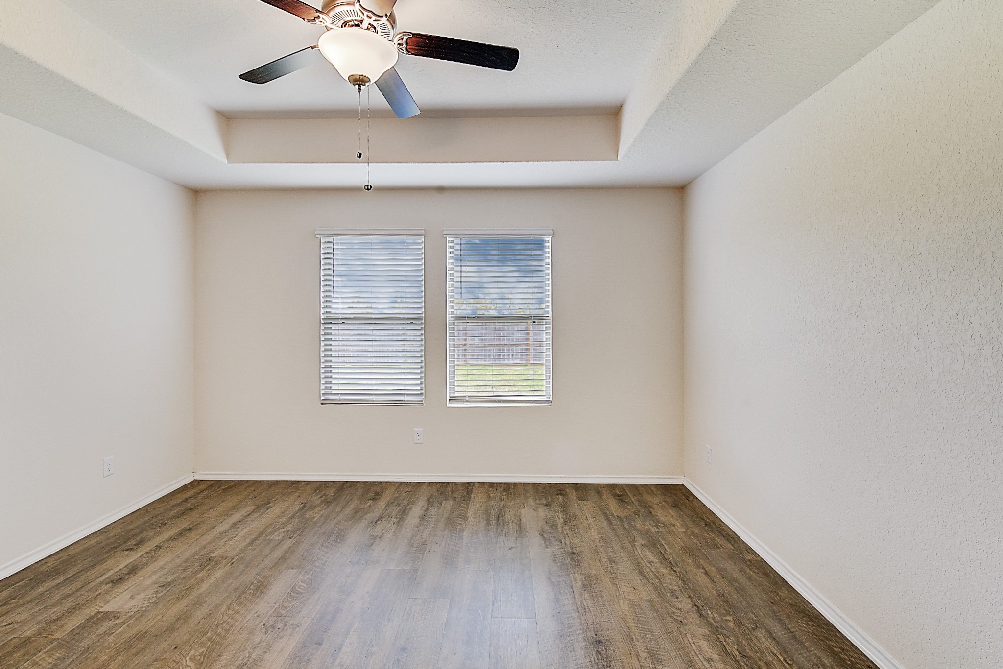 14468 Conifer Drive Conroe, TX 77302 - Photo 8 of 21 an empty room with a window and wooden floor