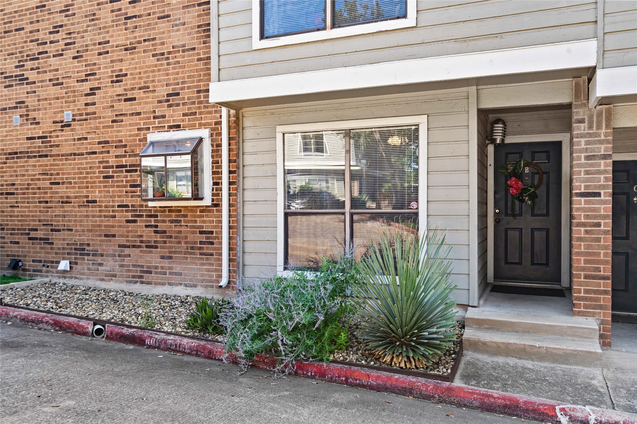 2018 West Rundberg Lane, Unit 4B Austin, TX 78758 - Photo 26 of 28 a potted plant in front of a house