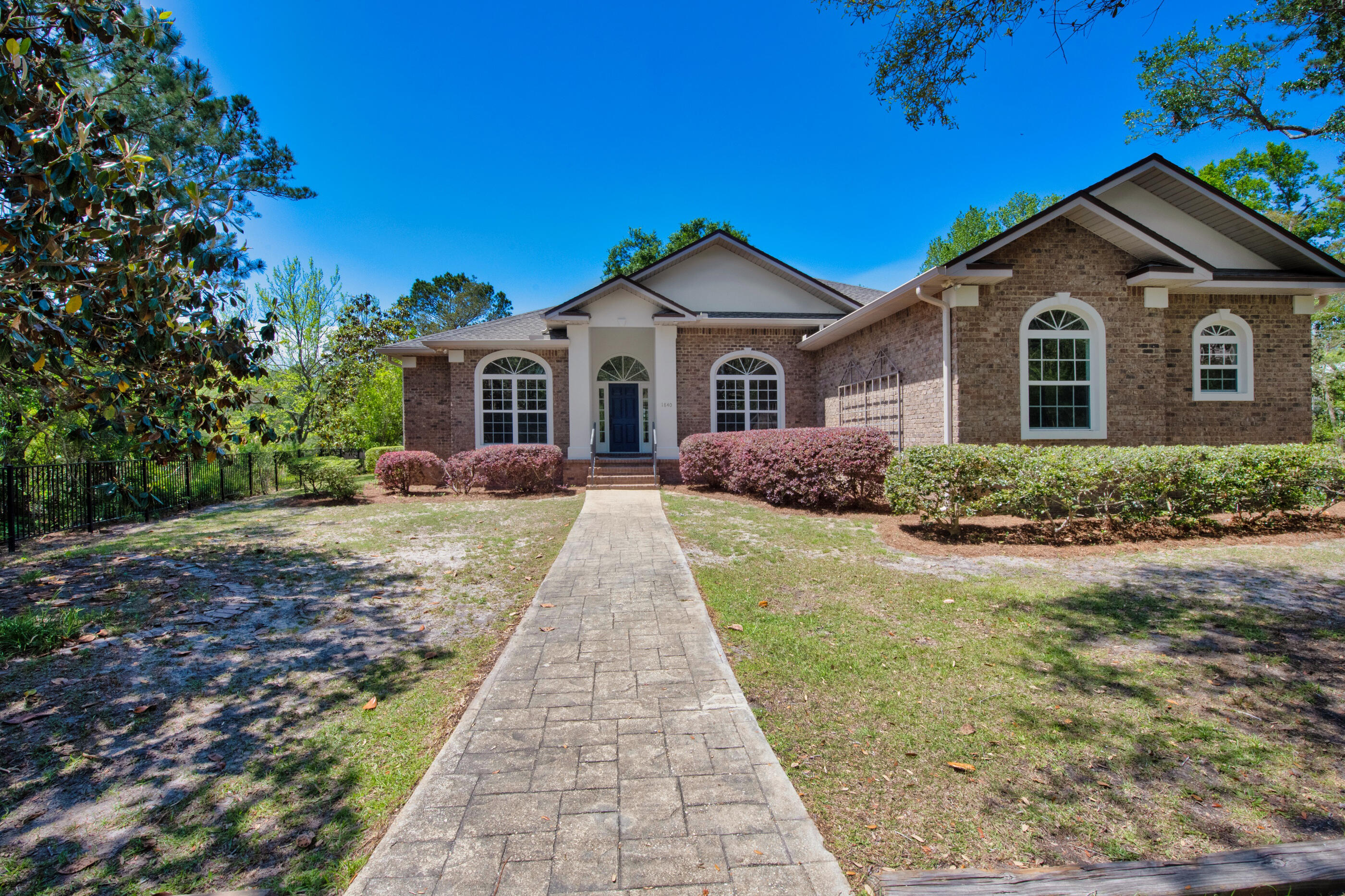 a front view of a house with yard