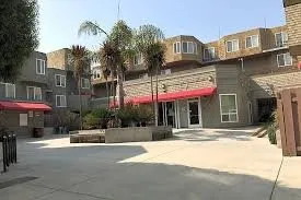 a view of a building with a people on a street