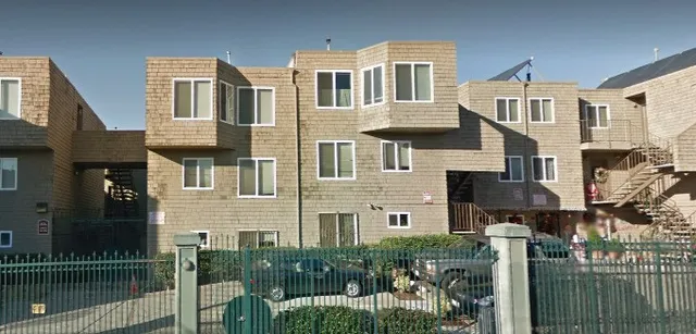 a front view of a house with lake view and a yard